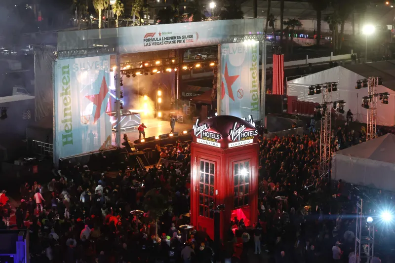 Virgin sponsor activation at the F1 Las Vegas Grand Prix 2024. Virgin red phonebooth installation, fan engagement zone