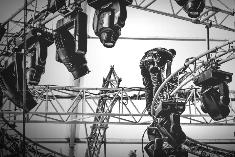 image of crew rigging lights up high